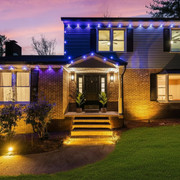 Property exterior at dusk with elegant lighting